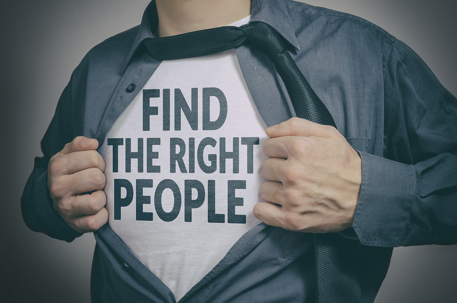 Man Showing Find The Right People Tittle On T-shirt.